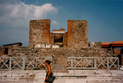 [Brick-faced ruins of a high-standing Roman temple.]